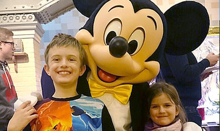 Niko and his sister with Mickey Mouse